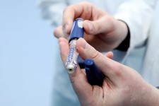 Doctor Showing Insulin