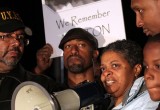 Freda Waiters with Attorney Mawuli Davis addressing a crowd.