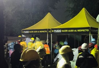 Volunteer Ministers tent at La Condesa provided a bit of shelter from the driving rain.