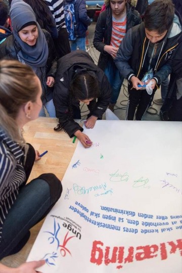 Students signed a pledge signifying their commitment  to combating discrimination—a factor underlying most  cases of bullying.