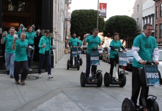 Scientologists roll out from the Church of Scientology of San Francisco en route to the Embarcadero where they handed out thousands of copies of The Truth About Drugs booklets throughout the week leading up to the NFL championship.