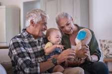 Older adults playing with their grandchild