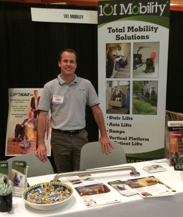 Chris Boyle, owner of 101 Mobility of Denver, stands at his exhibition booth at The Amazing Aging Expo in Denver, Colorado.