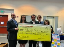 The first check donated through the solar partnership