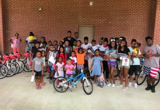 Robert Alford and 30 children with their new woom bikes