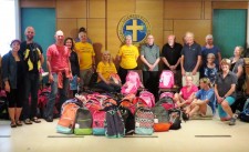 Interfaith Ministries of Greater Queen Anne at Church of Scientology, with backpacks for Mary's Place kids