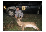 Officer Borkovich with poached 8 point buck