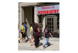 Visitors enter the Psychiatry: An Industry of Death exhibit in Atlanta's Piedmont Park.