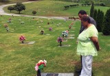 Freda Waiters and Rev. Vicion Jones at Ariston's gravesite.
