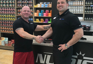 Jake Halvig (left), NUTRISHOP\u00ae franchisee of the Roseville, CA location and the flagship 24 Hour Fit