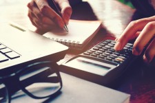 Person Calculating Finances