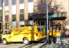 Scientology Volunteer Ministers load up their van with donated goods for those in need. 