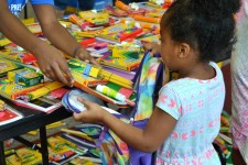 Child Receiving School Supplies