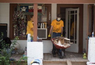 Scientology Volunteer Ministers help muck out a home that was flooded by Hurricane Harvey.