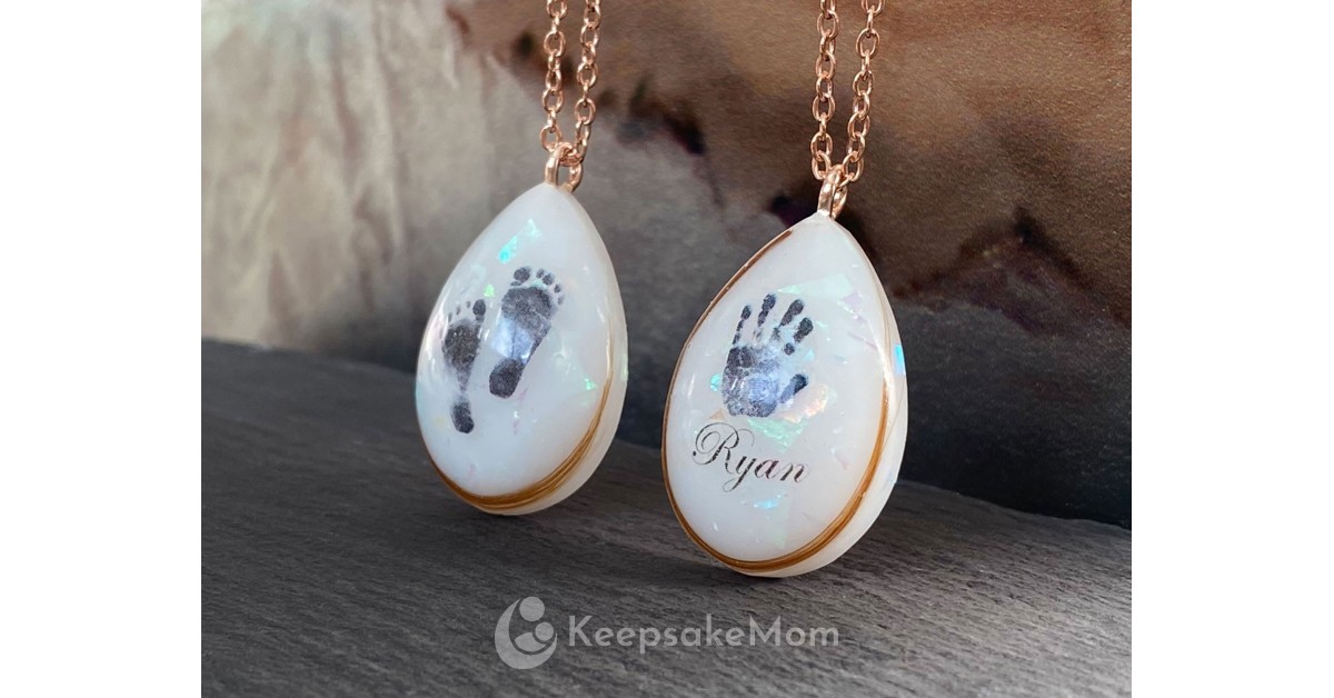 KeepsakeMom Adds Stunning Angel Prints Necklace to Breastmilk