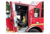 The highlight of the National Night Out block party for the younger set was the chance to sit in the bright red fire truck