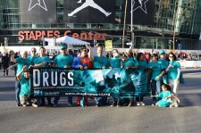 Drug-Free World volunteers at Staples Center at the NBA All-Star game, where they handed out 30,000 copies of Truth About Drugs booklets to fans.