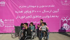 Children with disabilities receive wheelchairs