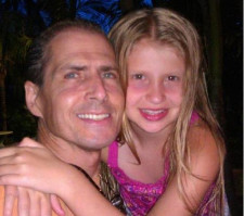Devin as a child with her father