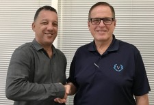 A.D. Albertini, chairman of Aries Transporte S.A., congratulates Victory Cruise Lines President and CEO Bruce Nierenberg
