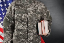 Veteran Holding Books for College