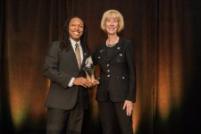 Jamison F. Gavin receiving 30 Under 30 Award with Julie Stroh, VP of UCF Alumni Engagement