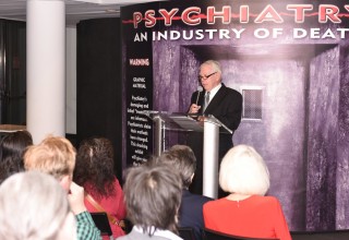 CCHR Canada President Robert Dobson-Smith welcomes visitors to Psychiatry: An Industry of Death Exhibit September 8, 2017, at Toronto's St. Lawrence Centre for the Arts.