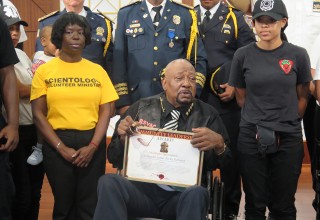 Commander James "Rocky" Robinson of the Bedford-Stuyvesant Volunteer Ambulance Corps is presented the Community Leadership Award by the Church of Scientology Harlem. 