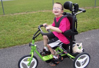 A previous winner of the adaptive bike giveaway 