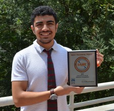 Abdullah Almosalami holds the team award