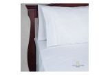 Cosy House White Wavy Bed Sheets On Bed View